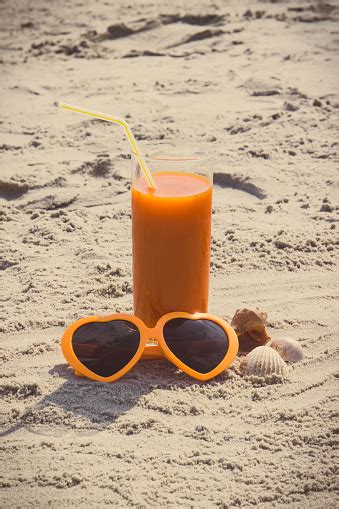 Vintage Photo Carrot Juice And Sunglasses At Beach Concept Of Vitamin A And Beautiful Lasting