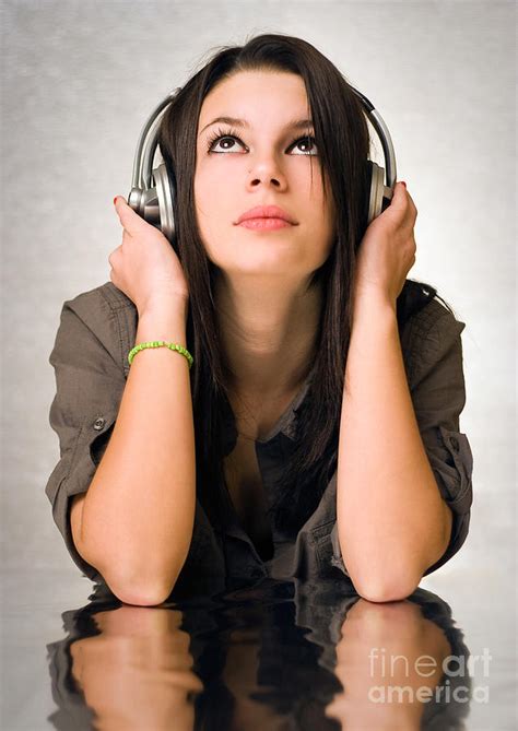 Beautiful Young Brunette Enyjoying Music In Silver Headphones 2