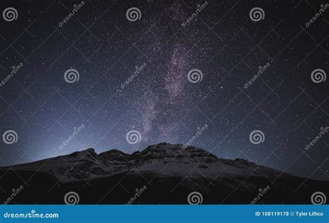 Milky Way And Stars Above A Snowy Mountain Peak Stock Photo Image Of