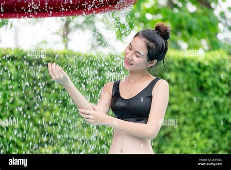 Young Woman Taking Shower At Swimming Pool In Luxury Resort Hotel Travel And Summer Lifestyle