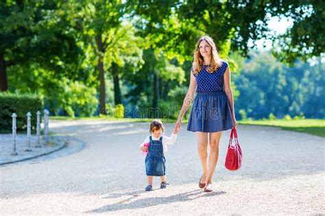Mother And Her Little Daughter Walking In Summer Stock Photo Image Of