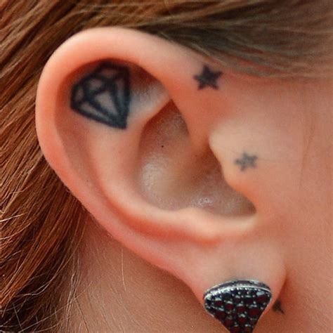 Based on her zodiac sign which is a leo, she has a lion tattoo on her finger, which was her first. 14 Cara Delevingne Tattoos to Get Inspired - EntertainmentMesh