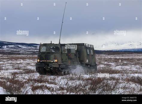 A Small Unit Support Vehicle Susv Moves Across The Drop Zone After