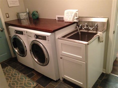 Stacked washer/dryer laundry room ideas. Laundry room redo - Cabinets and butcher block top - by ...