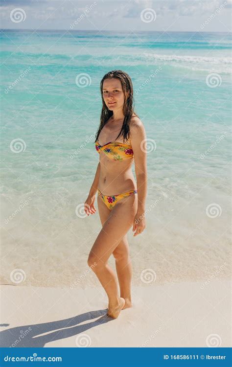 brunette girl in a bright swimsuit on the beach in cancun mexico stock image image of blue