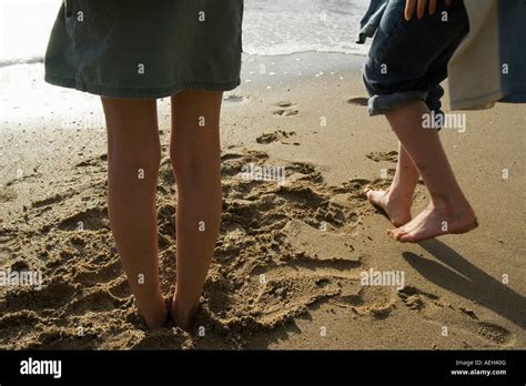 Childrens Legs And Feet At Of Sea Stock Photo Alamy