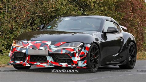 2025 Toyota Supra Grmn Spied With Canards And Rear Wing Could Pack Bmw