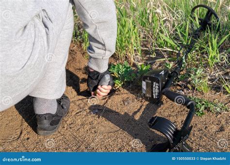 Man With Metal Detector Looking For A Treasure Stock Image Image Of