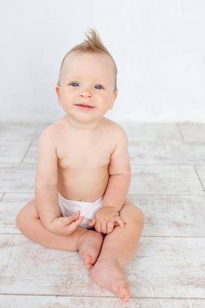 Premium Photo Cute Baby Boy In Diapers On A White Background With A