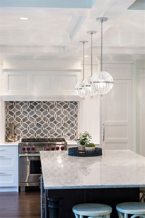 The kitchen backsplash is placed on the kitchen wall between the countertops and the wall cabinets. White Kitchen with Blue Gray Backsplash Tile - Home Bunch ...
