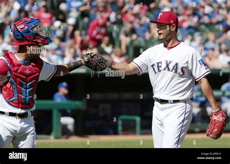 Texas Rangers Pitcher Yu Darvish R And Catcher Robinson Chirinos Bump Fists After Ending The