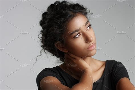 Young Girl With Perfect Light Brown Skin And Beautiful Curly Black Hair