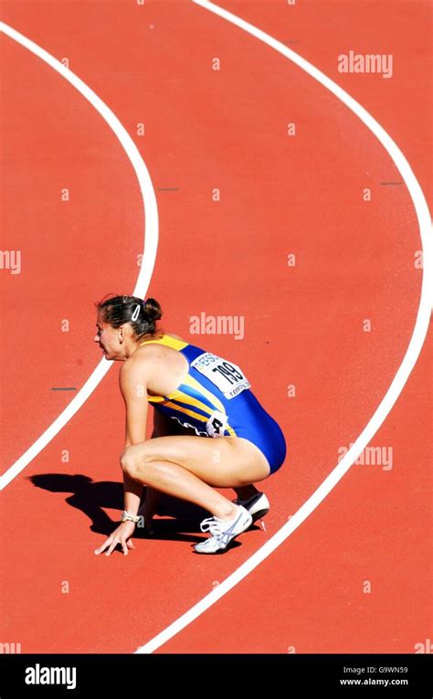 Ukraine S Zhanna Pintusevich Block Rests On The Track Following Her Win In The Final Of The