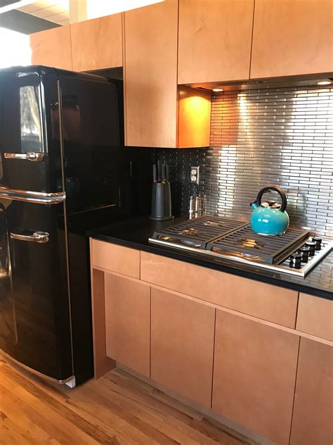 You will need to add the installation cost to the original cost of the quartz to know what you are likely to spend on the entire project. Stainless steel backsplash with black quartz countertops ...
