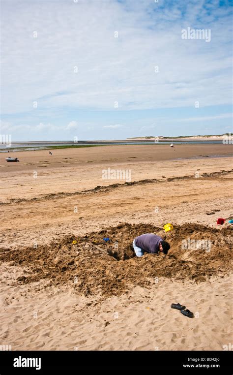 Digging Hole In Sand Hi Res Stock Photography And Images Alamy