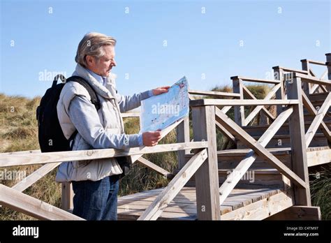Man Reading Map Cala Ratjada Mallorca Balearic Islands Spain Stock