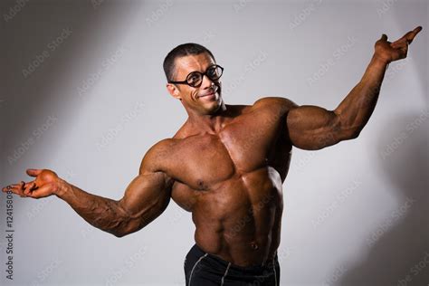 Happy Muscular Man With A Naked Torso And Funny Glasses Stock Photo