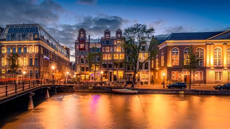 Фото Амстердам голландия Мосты Реки Вечер Уличные фонари 1920x1080