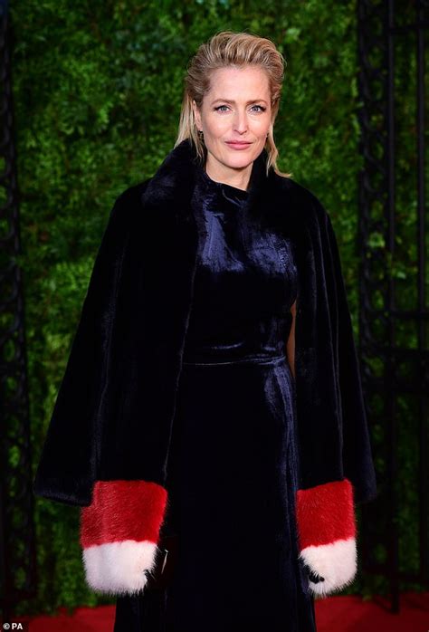 Gillian Anderson Wears An Inky Blue Velvet Dress And A Fur Scarf At The