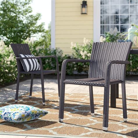 The full back with integrated arms provides comfort to customers. Sol 72 Outdoor™ Blakely Stacking Patio Dining Chair ...