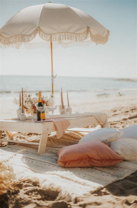stunning boho picnic engagement rosewood miramar beach santa barbara picnic co romantic