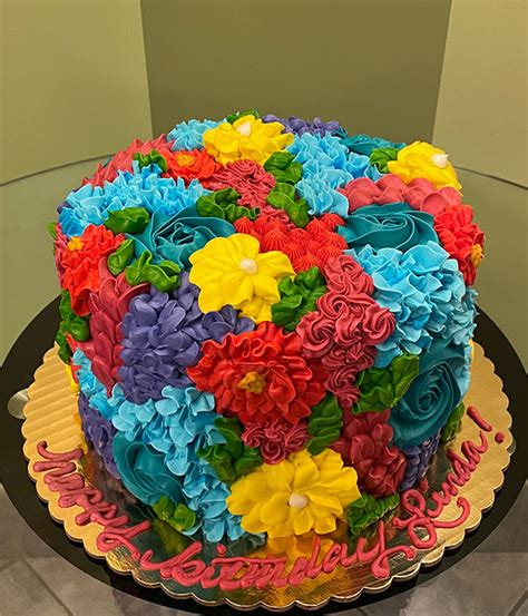Assorted Flower Covered Layer Cake Classy Girl Cupcakes