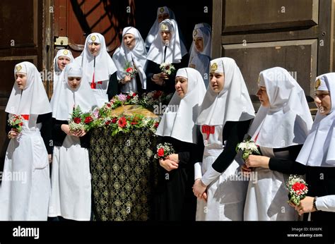 Portrait Of Eastern Orthodox Nuns During A Good Friday Procession In