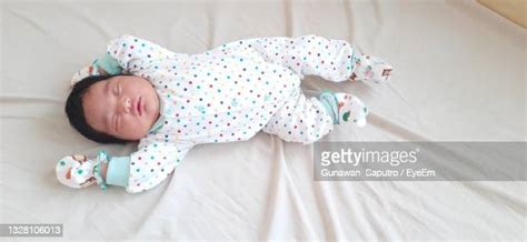 Baby In Crib Top View Photos And Premium High Res Pictures Getty Images