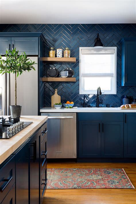 What are the best outdoor kitchen countertops? Dark blue kitchen cabinets with blue tile backsplash ...