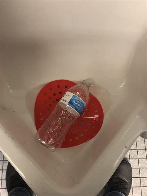 using a urinal as a trash can r trashy