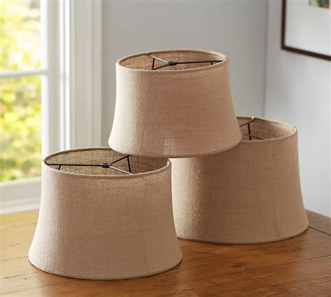 I covered two of these and one much larger shade. Burlap Sheer Tapered Drum Lamp Shade | Pottery Barn
