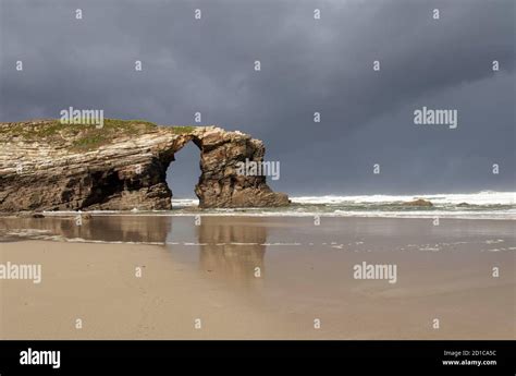 Hole In The Rock Formation At The Beach Of The Cathedralsribadeo Lugo