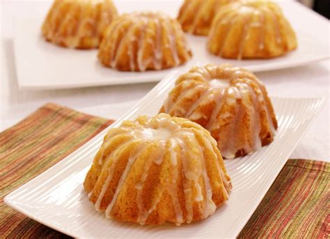 Using the back of a spoon, poke a few holes in the top of each cake, being and not just any cake, but mini cakes; Mini Orange Bundt Cakes - Olga's Flavor Factory