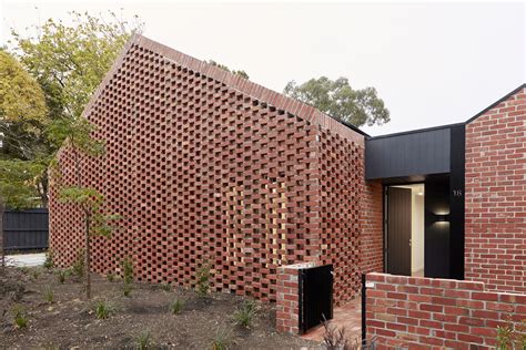 Recycled Brick Screens Wrapping These Two Dwellings Help Thermal