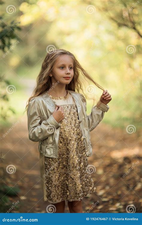 Autumn Portrait Of Adorable Smiling Little Girl Child In Leaves In The