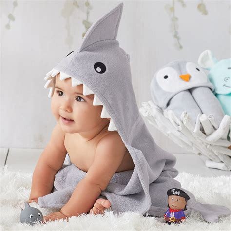 A warm bath is one of the best ways to soothe your baby before sleep, but it won't work if your baby gets too cold in between bath and pajamas. Elegant Baby Shark Hooded Towel - Stitch Sensations