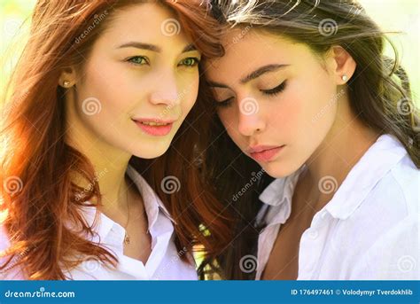 close up fashionable portrait couple of two cute girls best friends embracing perfect wavy