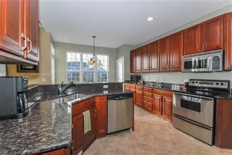 Neutral grey walls medium and warm honey cabinets example. cherry kitchen cabinets with grey walls - Google Search ...