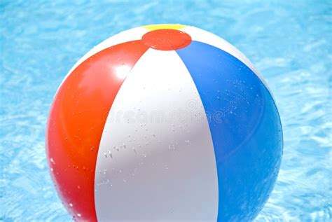 Beach Ball Floating In The Pool Stock Image Image Of Splashing