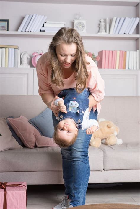 Mother Holds Happy Baby Upside Down Stock Image Image Of Happy