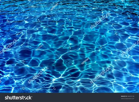 Definition of ripples in the idioms dictionary. Resort Pool Water Ripples In Evening. Stock Photo 94453126 ...