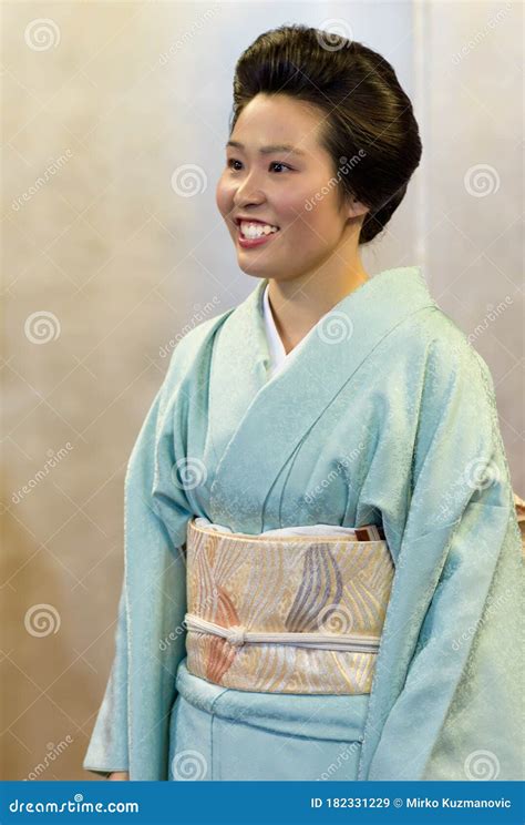 Japanese Maiko Geisha In Red Costume Sit In Tatami Floor Room W