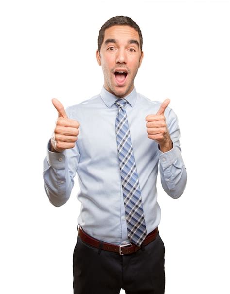 Premium Photo Satisfied Young Businessman Doing An Approval Gesture