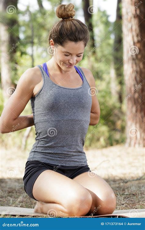Woman Outdoors Kneeling In Yoga Position Stock Photo Image Of