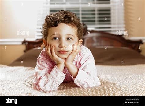 Boy Laying On Bed Stock Photo Alamy