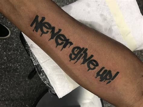 Feather into birds on shoulder. Never Give Up! Graffiti Lettering tattoo | Tattoos ...
