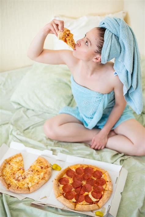 Cute Girl With A Towel On Her Head Eats Pizza In Bed Young Woman
