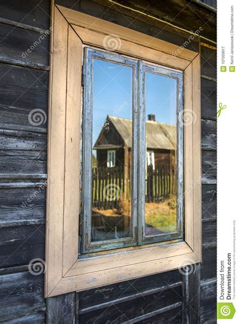 Old Wooden House Window With Reflection In The Glass Stock Image