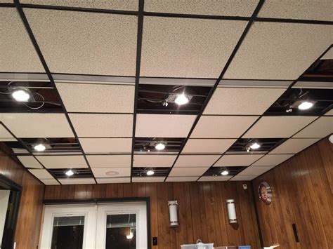 A track that screws into your ceiling and provides power for a series of independent lights that are suspended from it. DIY Recessed Lighting Installation in a Drop Ceiling ...
