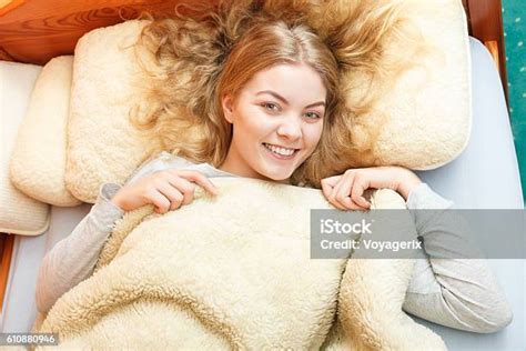Woman Waking Up In Bed In Morning After Sleeping Stock Photo Download